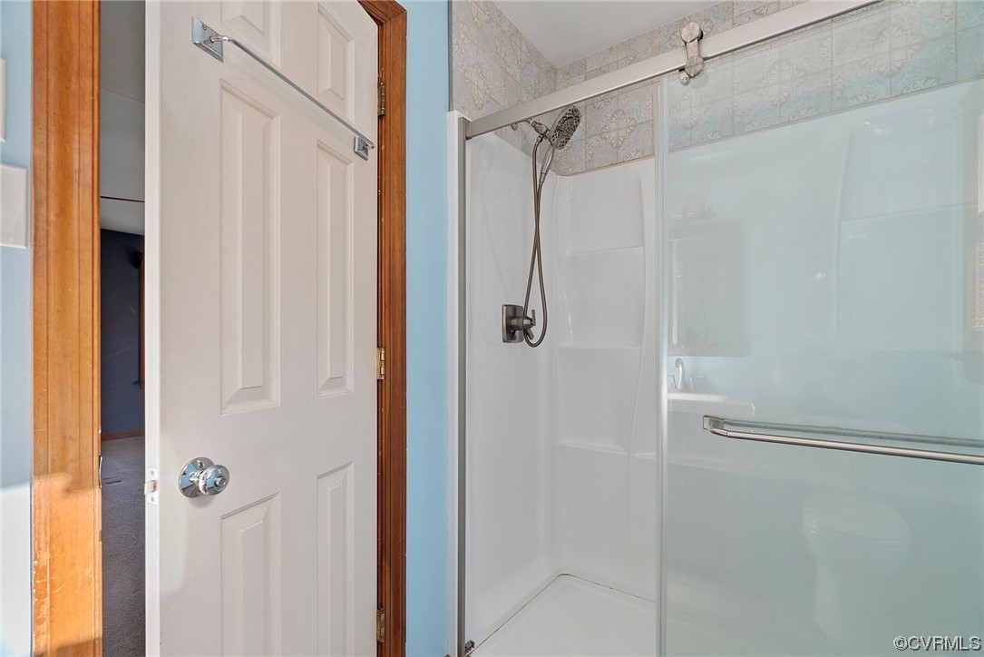 3319 Ludgate Road Chester, VA 23831 - Photo 31 of 47 a bathroom with a glass shower door