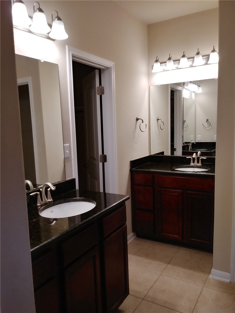 348 Stone View Trail Austin, TX 78737 - Photo 11 of 26 Dual vanities with plenty of lighting and granite counter tops in the master bathroom