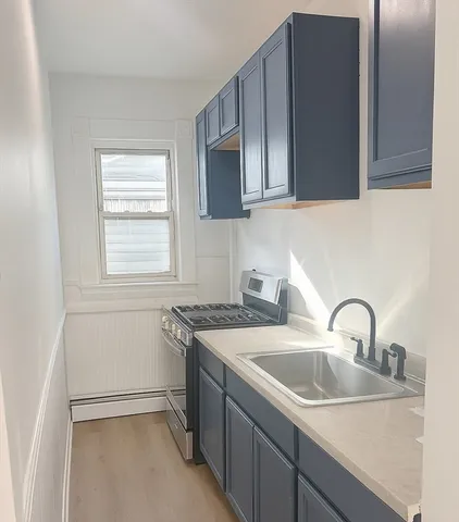 a kitchen with a sink and cabinets