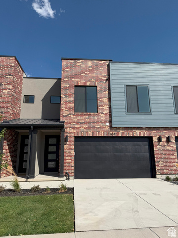 8087 South 615 East, Unit 3 Sandy, UT 84070 - Photo 2 of 23 Contemporary multi-level facade featuring brick and siding accents