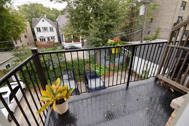 a view of a balcony with wooden floor