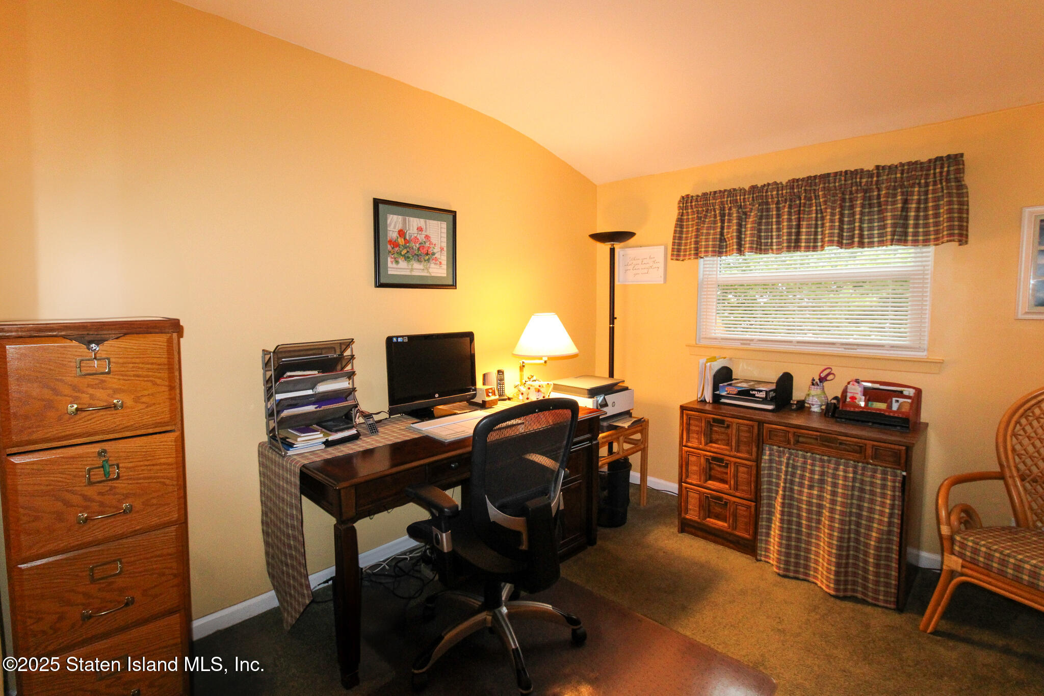 135 Freedom Avenue Staten Island, NY 10314 - Photo 11 of 29 a view of a workspace with furniture and a window