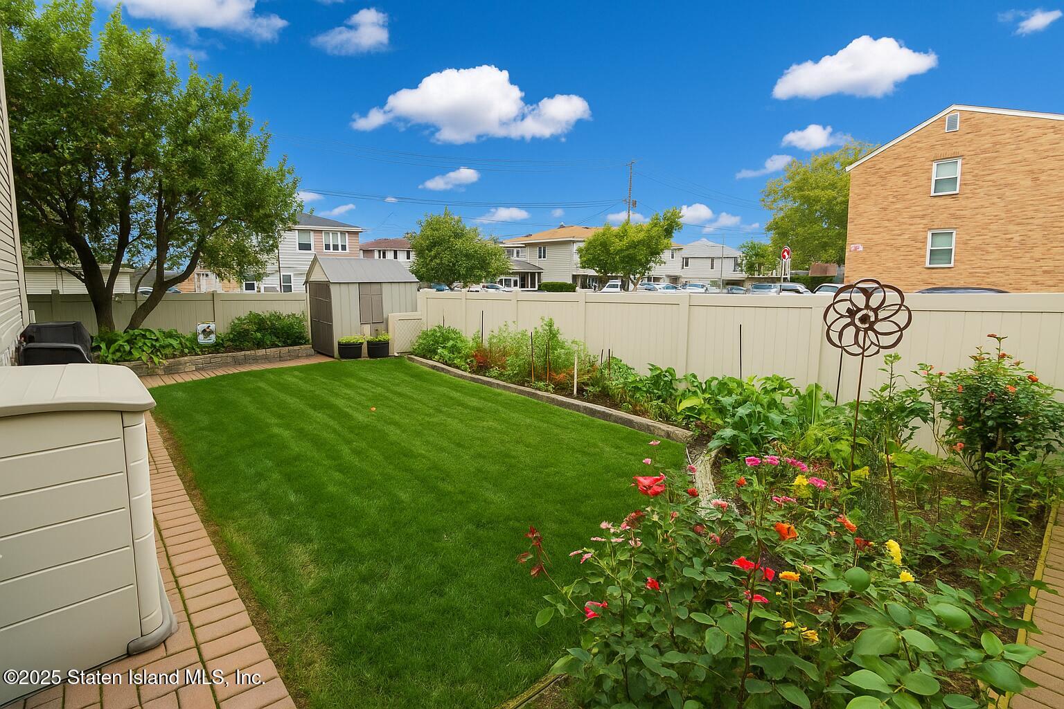 135 Freedom Avenue Staten Island, NY 10314 - Photo 25 of 29 a view of a garden with a house
