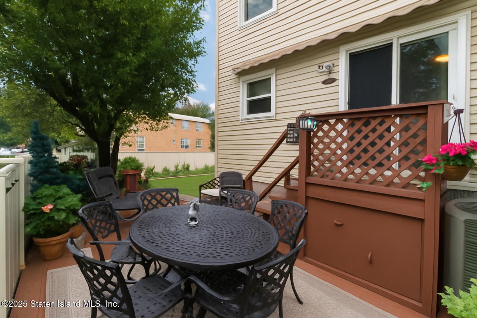 135 Freedom Avenue Staten Island, NY 10314 - Photo 26 of 29 a backyard of a house with wooden floor yard and outdoor seating