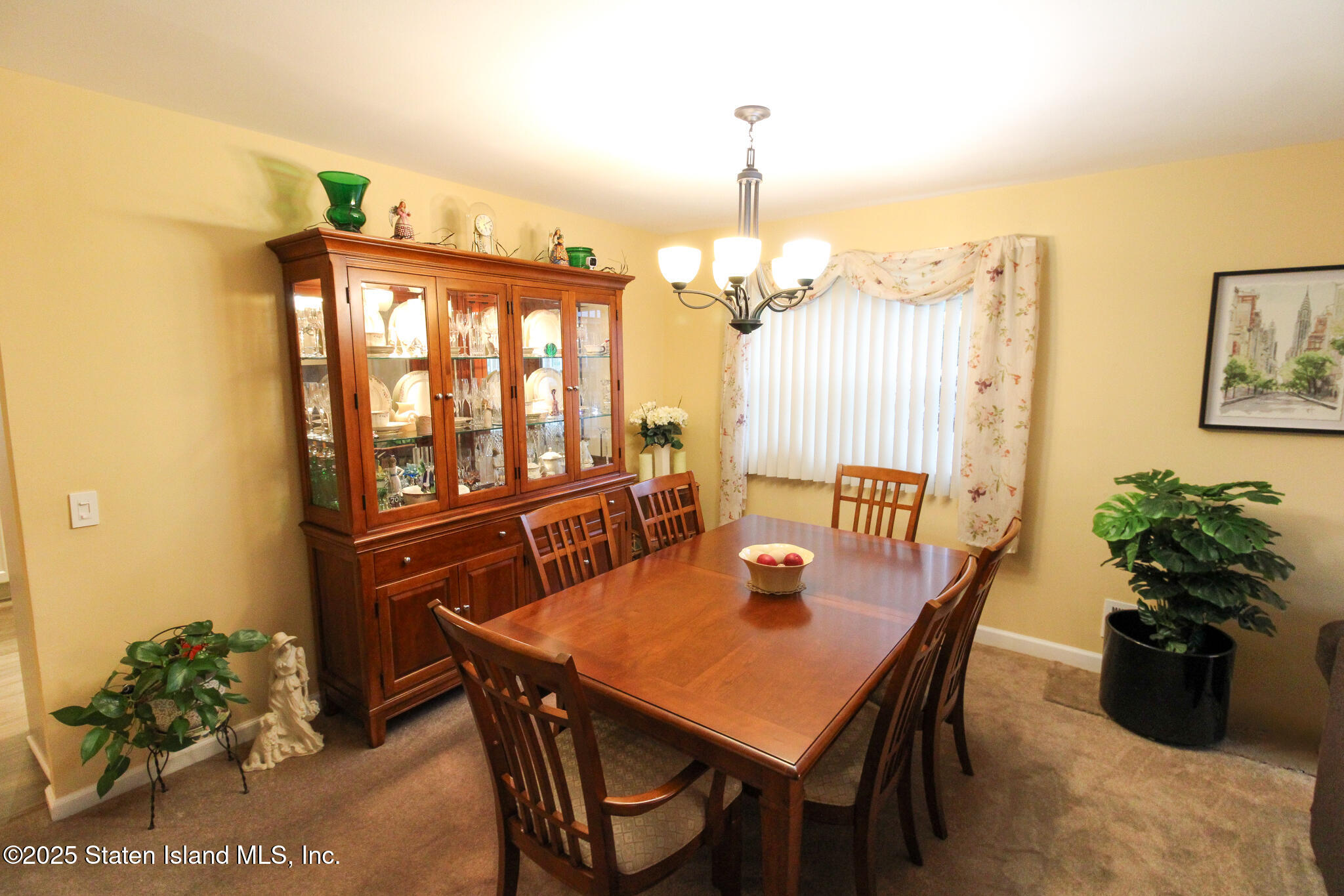 135 Freedom Avenue Staten Island, NY 10314 - Photo 4 of 29 a dining room with furniture window and wooden floor