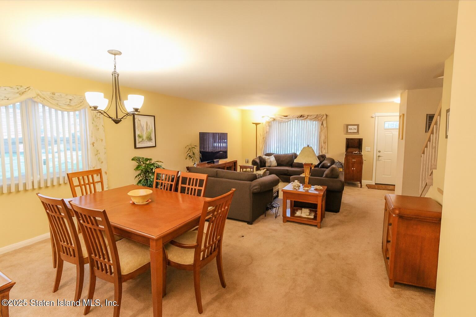 135 Freedom Avenue Staten Island, NY 10314 - Photo 5 of 29 a view of a dining room with furniture window and outside view