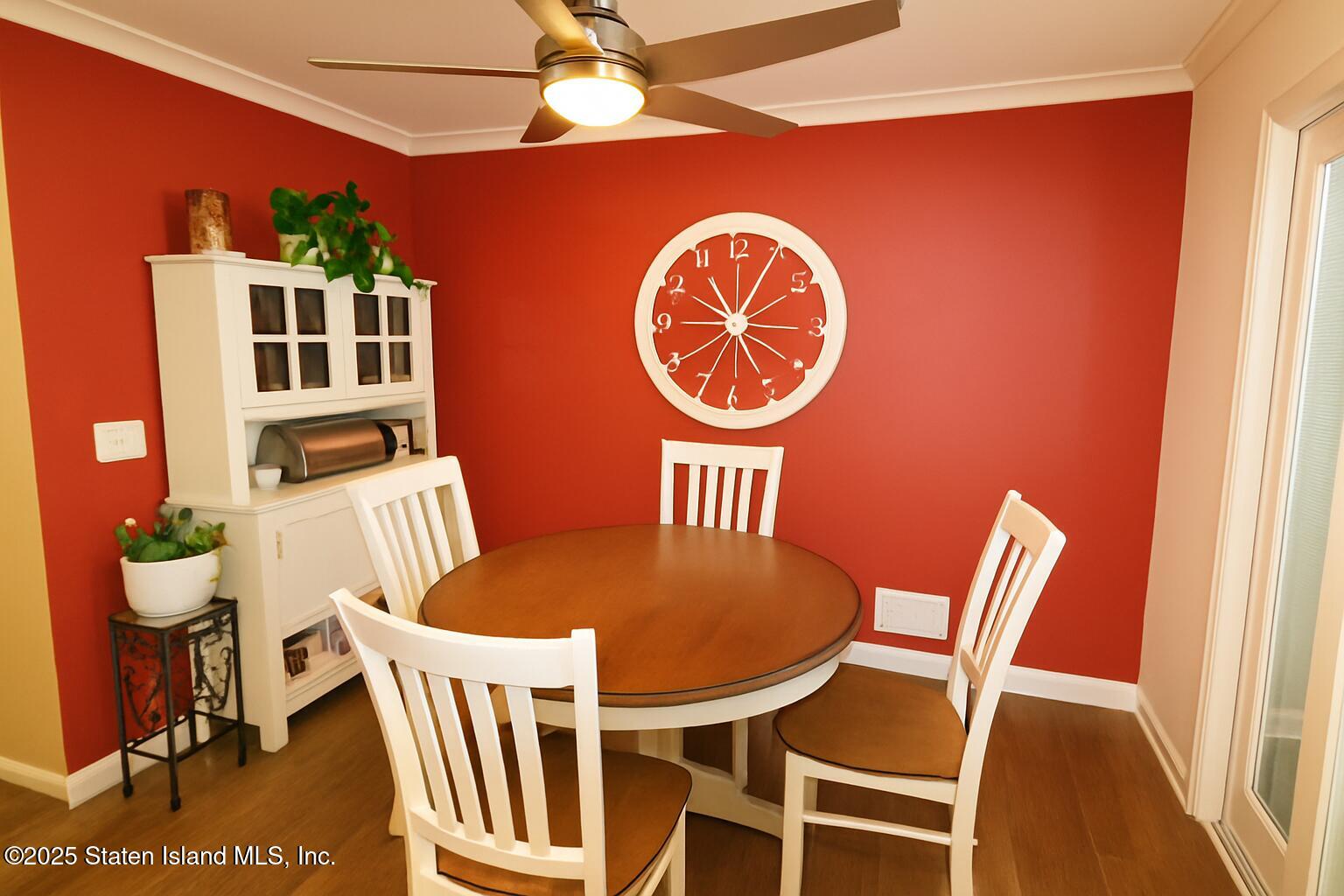 135 Freedom Avenue Staten Island, NY 10314 - Photo 6 of 29 a view of a dining room with furniture and wooden floor