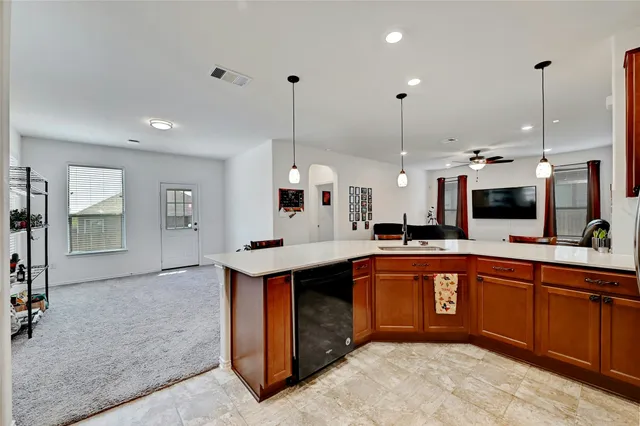 a view of a kitchen with car parked