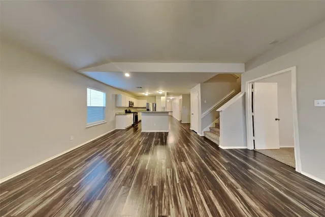 a view of gallery with wooden floor