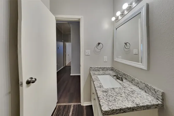 a view of a bathroom from a hallway