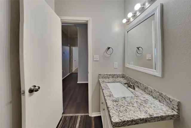 a view of a bathroom from a hallway