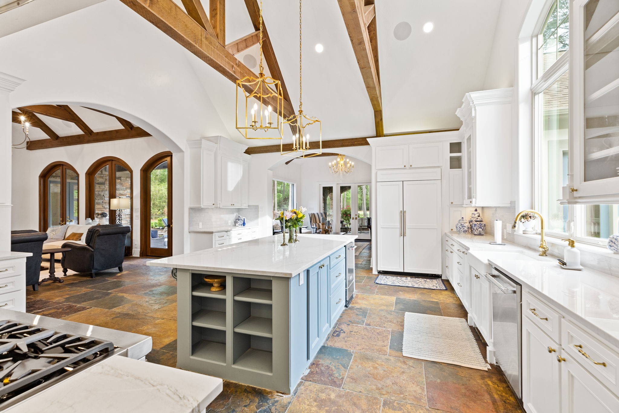 38223 Windy Ridge Trail Magnolia, TX 77355 - Photo 15 of 48 Another view of this amazing gourmet kitchen with a view of the family room and the living room/sunroom.