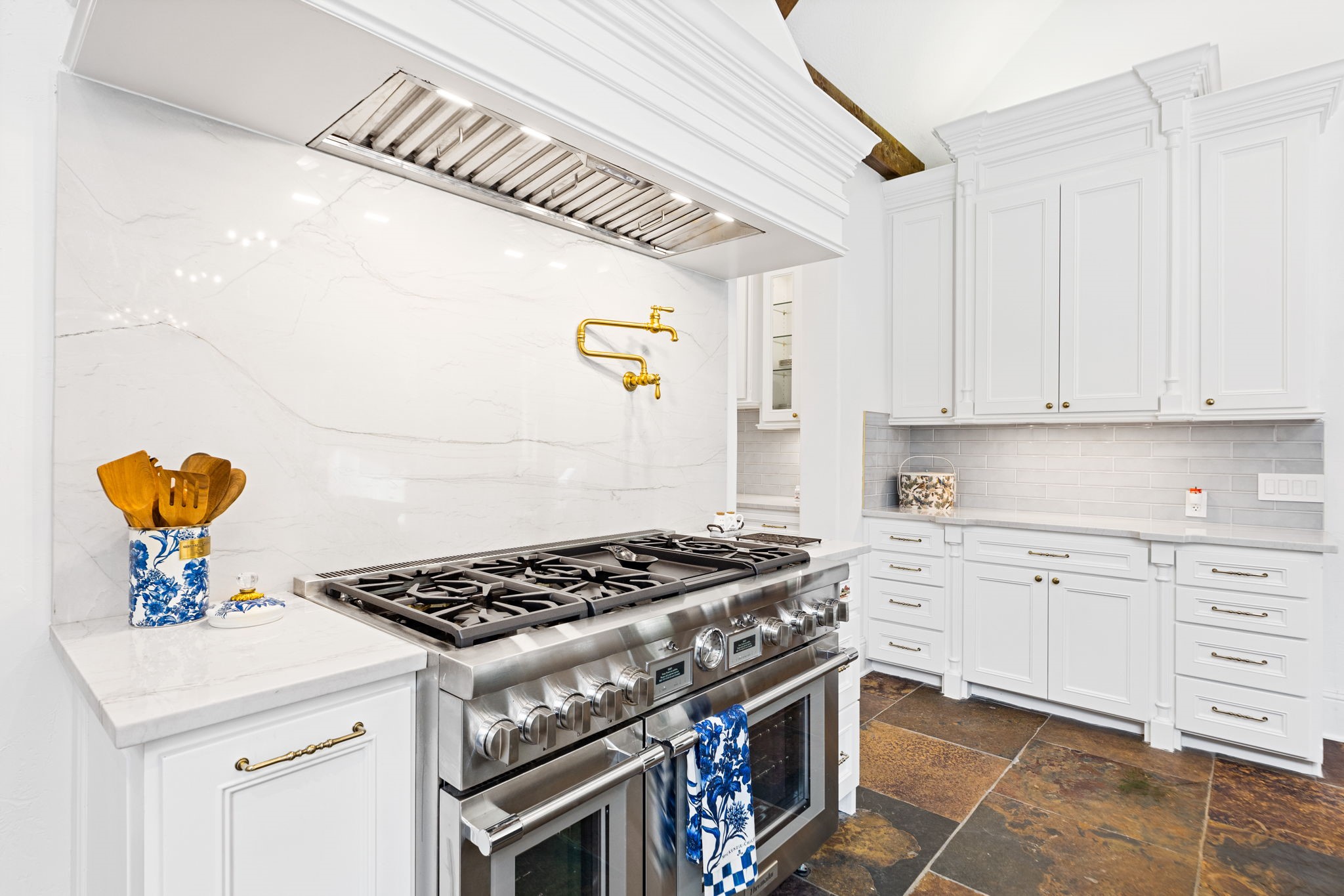 38223 Windy Ridge Trail Magnolia, TX 77355 - Photo 16 of 48 a kitchen with stainless steel appliances a stove a chimney and a refrigerator