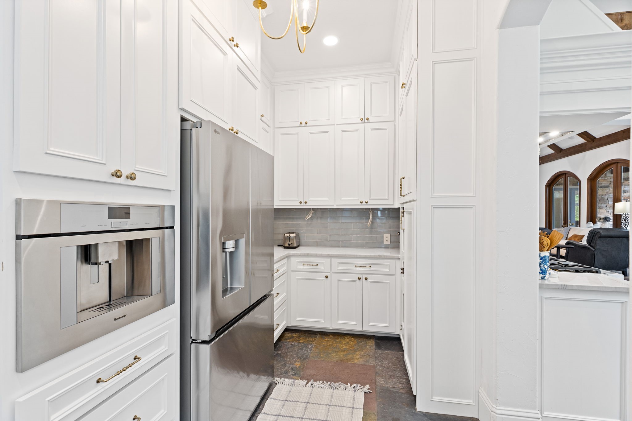 38223 Windy Ridge Trail Magnolia, TX 77355 - Photo 17 of 48 This prep kitchen was added and is complete with a new refrigerator, built-in Thermador coffee maker and plenty of built-in pantries and gorgeous elegant lighting.