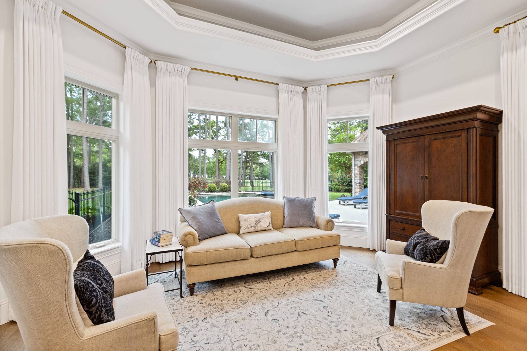 38223 Windy Ridge Trail Magnolia, TX 77355 - Photo 21 of 48 This inviting sitting area in the primary bedroom features large windows offering natural light and scenic views. Perfect place for your furniture and to enjoy reading a book.