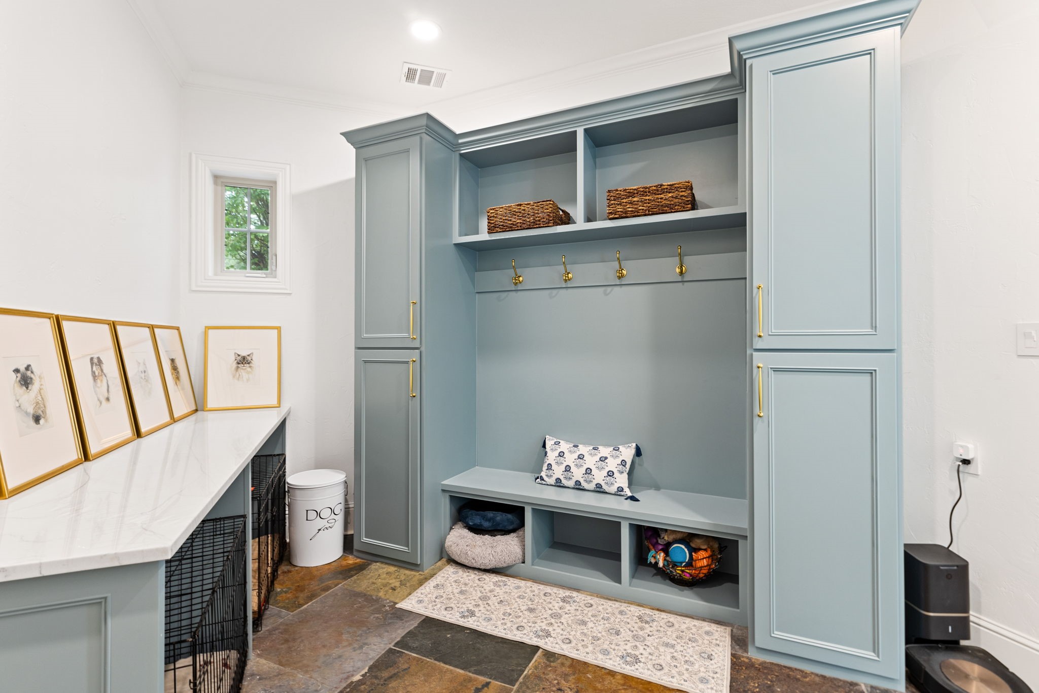 38223 Windy Ridge Trail Magnolia, TX 77355 - Photo 32 of 48 This photo shows a stylish mudroom with gorgeous light blue cabinetry, built-in storage, and a bench. It features hooks for coats and shelves for organization.