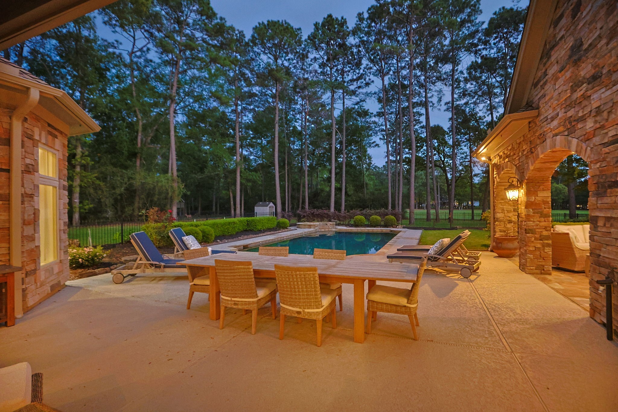 38223 Windy Ridge Trail Magnolia, TX 77355 - Photo 36 of 48 A stunning sunset view of the pool and outdoor living space. Great place to wind down in the evening!