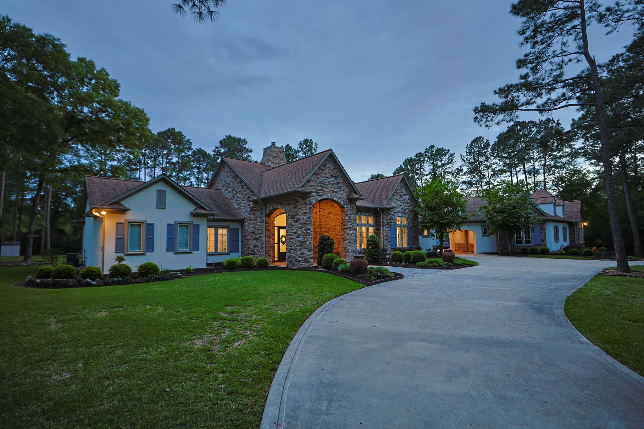 38223 Windy Ridge Trail Magnolia, TX 77355 - Photo 4 of 48 a front view of a house with a yard and garage