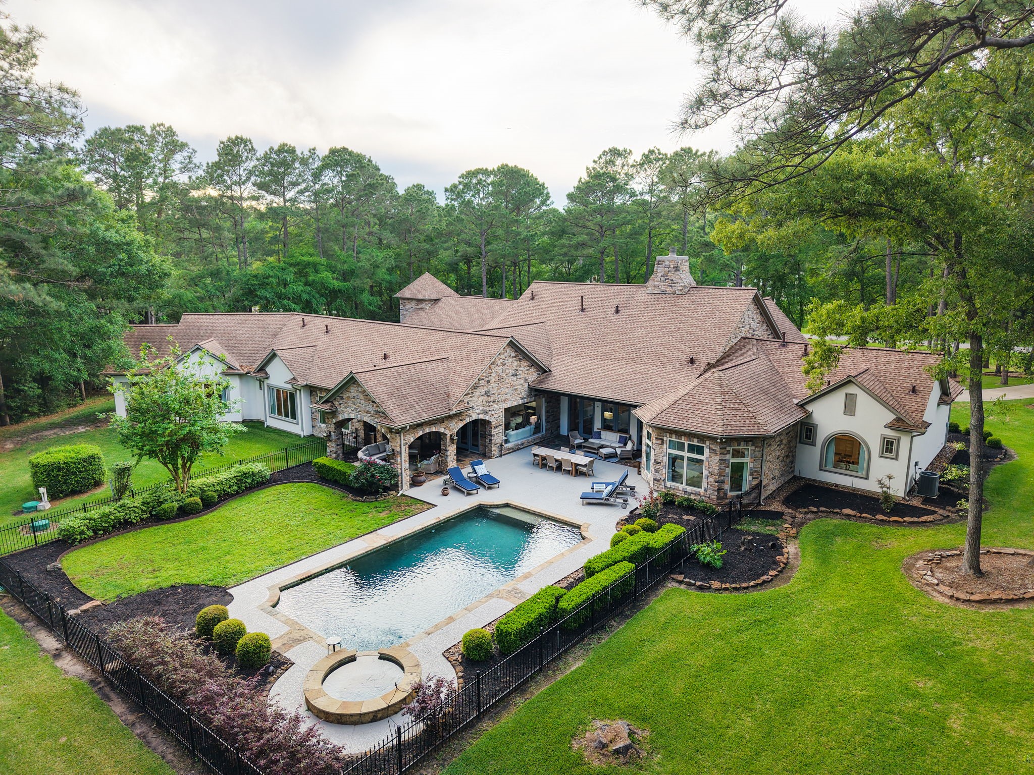 38223 Windy Ridge Trail Magnolia, TX 77355 - Photo 48 of 48 an aerial view of a house with swimming pool and garden