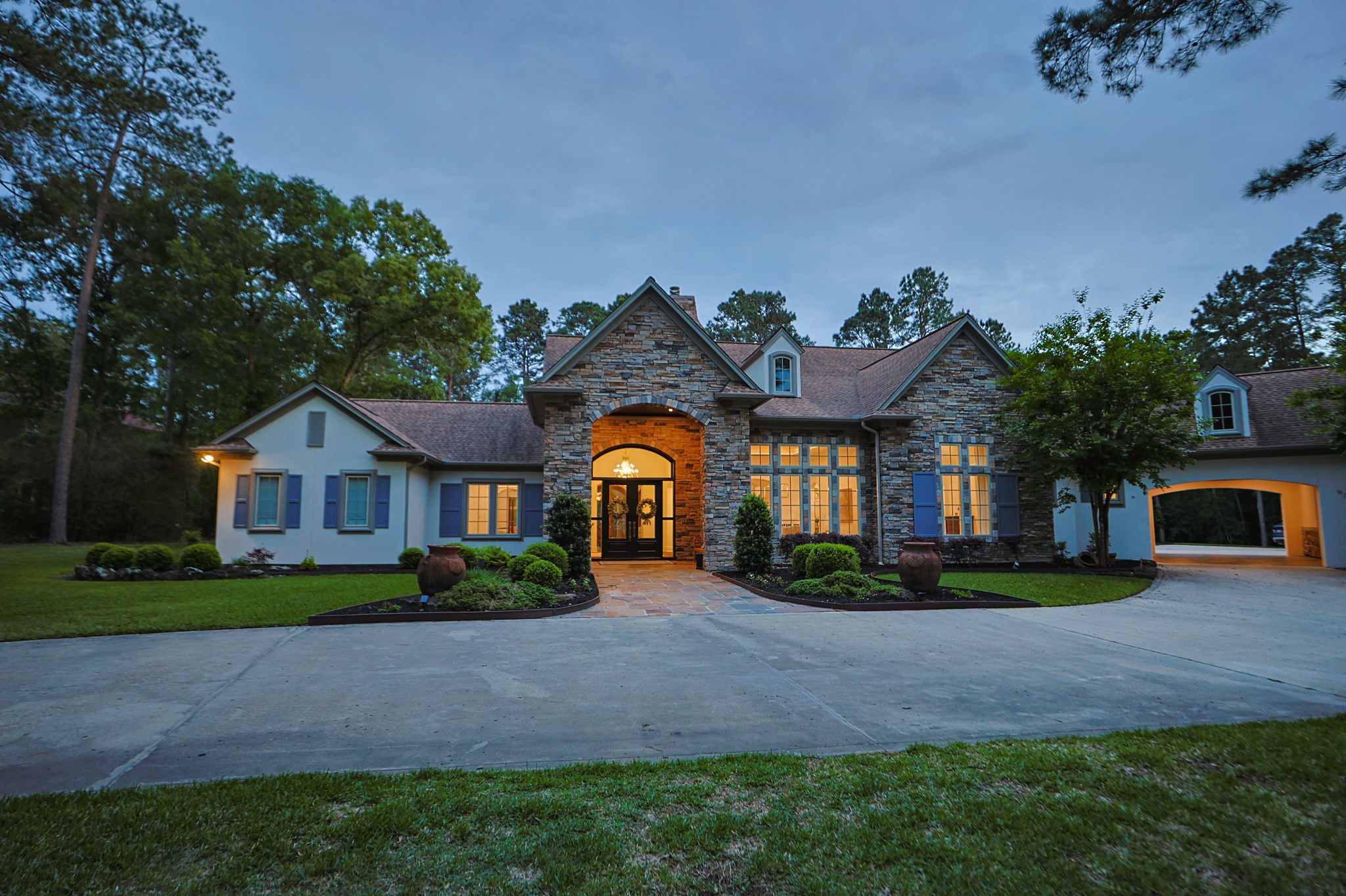 38223 Windy Ridge Trail Magnolia, TX 77355 - Photo 6 of 48 a front view of a house with a yard and outdoor seating