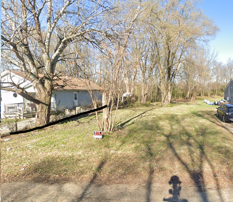 a view of yard with trees