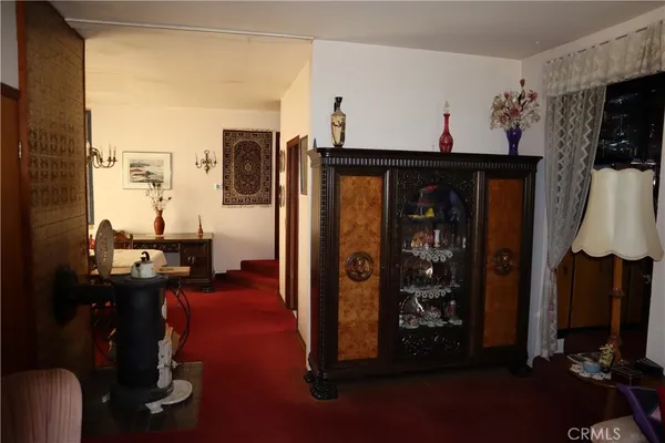 a room with furniture a flat screen tv and a window