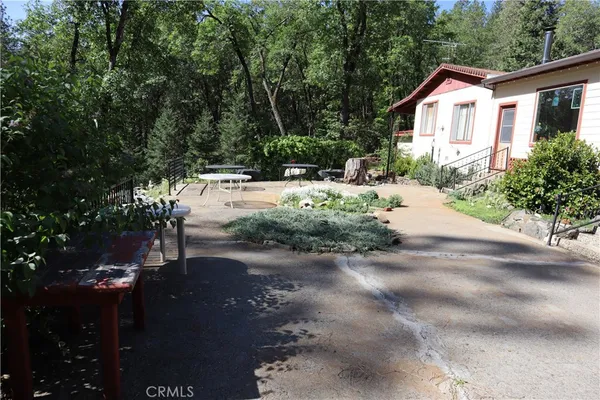 a view of backyard with a patio and outdoor seating