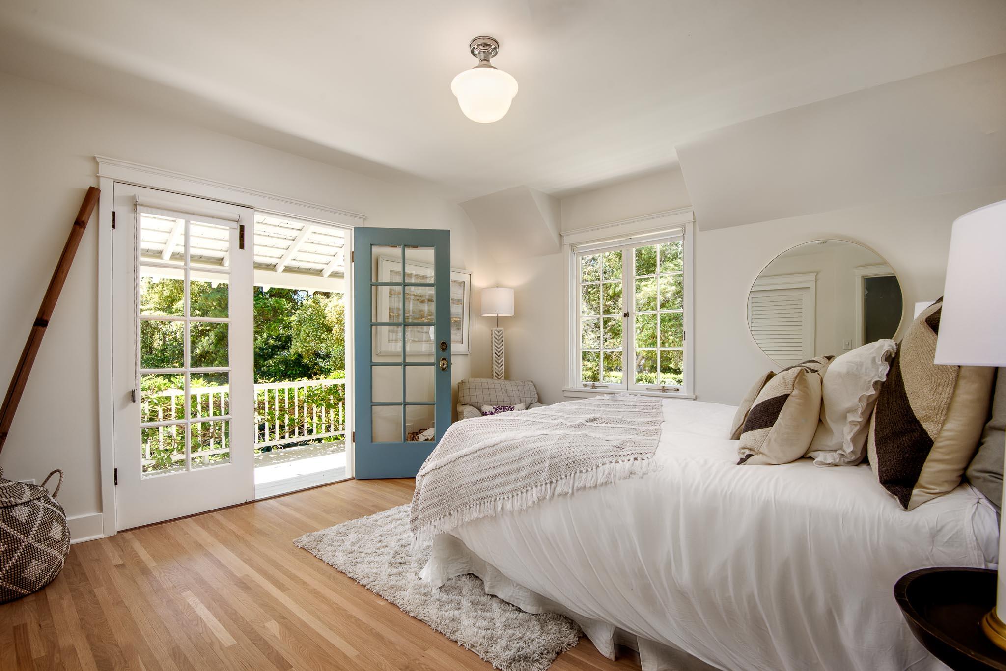 167 Pomar Lane Montecito, CA 93108 - Photo 18 of 35 a bedroom with a bed and a large window