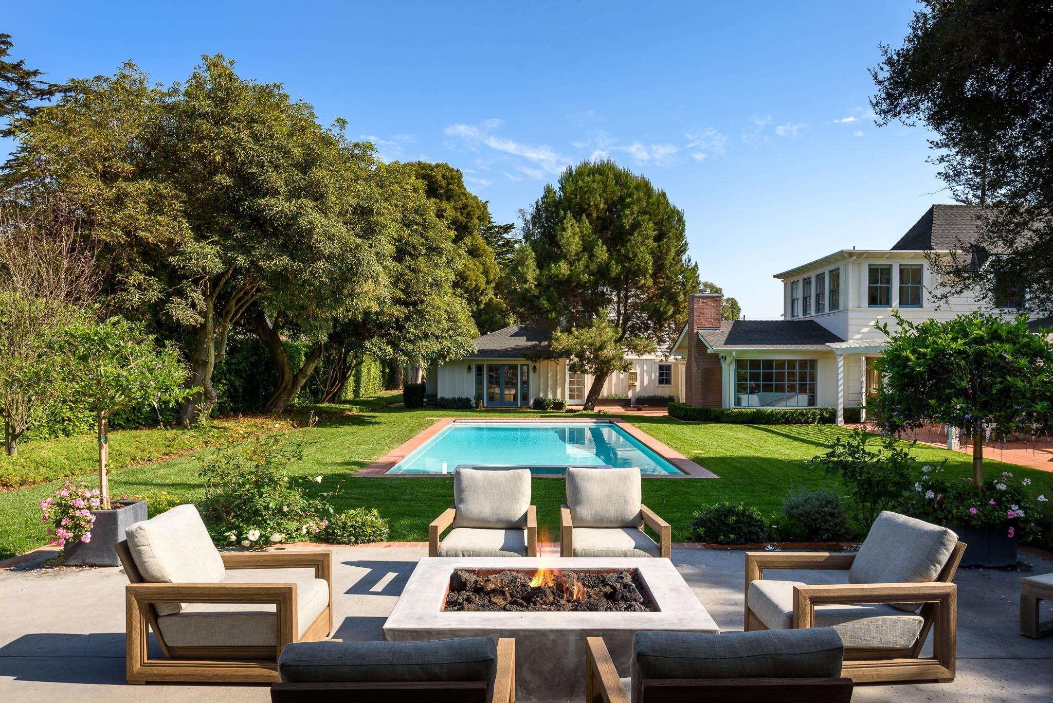 167 Pomar Lane Montecito, CA 93108 - Photo 28 of 35 a view of a patio with couches table and chairs with plants and trees