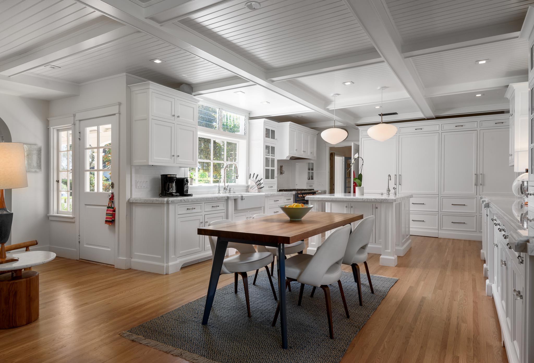 167 Pomar Lane Montecito, CA 93108 - Photo 7 of 35 a kitchen with stainless steel appliances kitchen island granite countertop a table chairs sink and cabinets