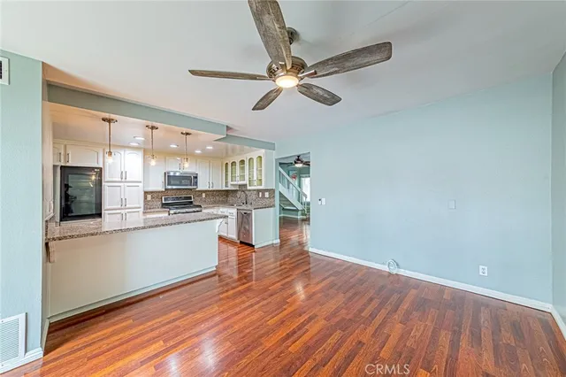 a view of kitchen with wooden floor