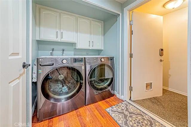 a view of bathroom with washer and dryer