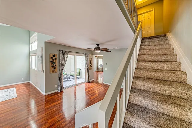 a view of entryway and hall with wooden floor