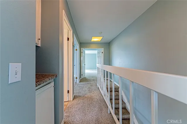 a view of a hallway with staircase
