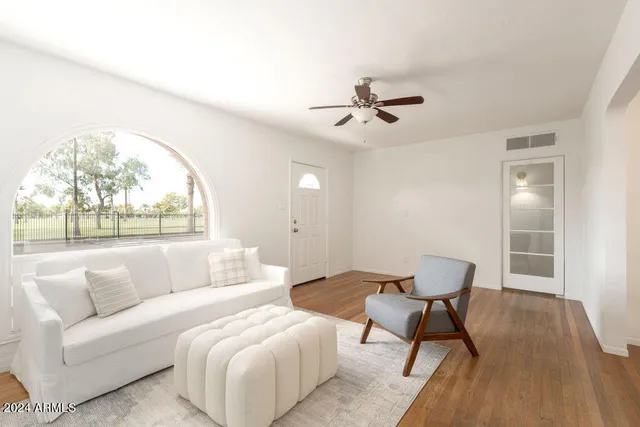 a living room with furniture and a window