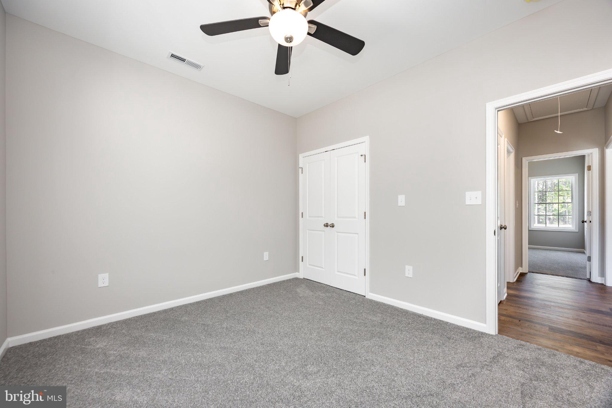 14949 Shiloh Church Road Laurel, DE 19956 - Photo 25 of 32 an empty room with a fan and a ceiling fan