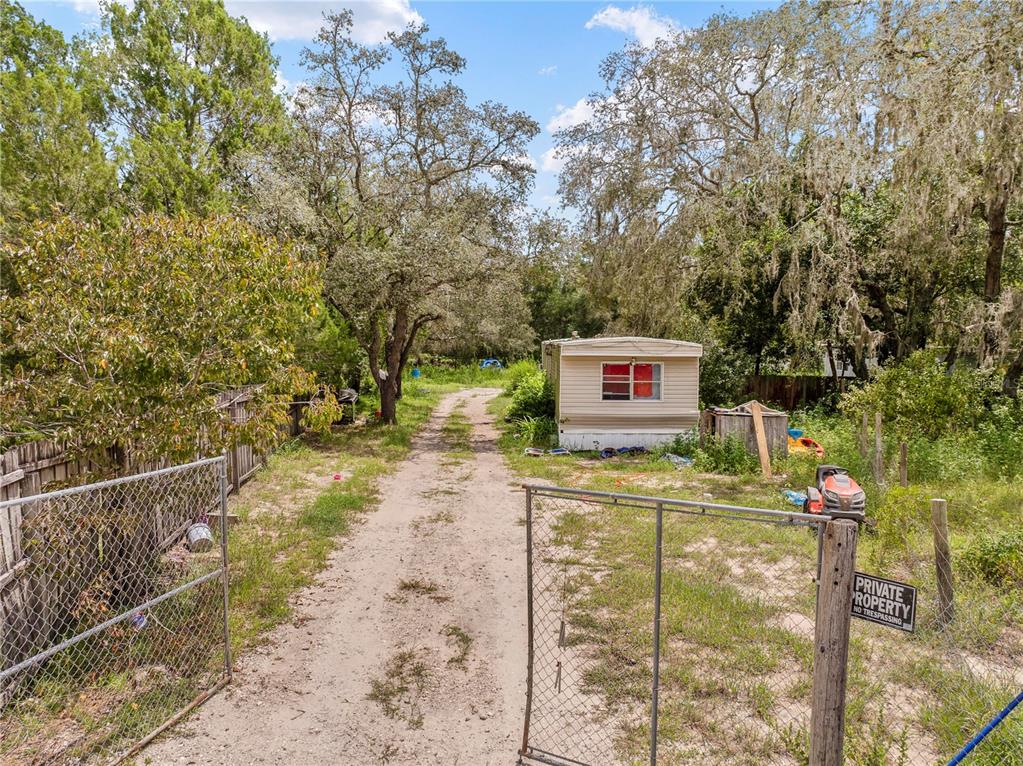16710 Monteverde Drive Spring Hill, FL 34610 - Photo 2 of 16 a sign board with a yard