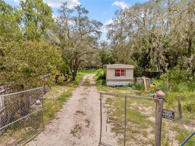 a sign board with a yard