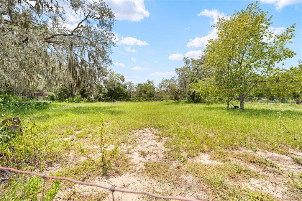 16710 Monteverde Drive Spring Hill, FL 34610 - Photo 8 of 16 a view of a lake with a big yard