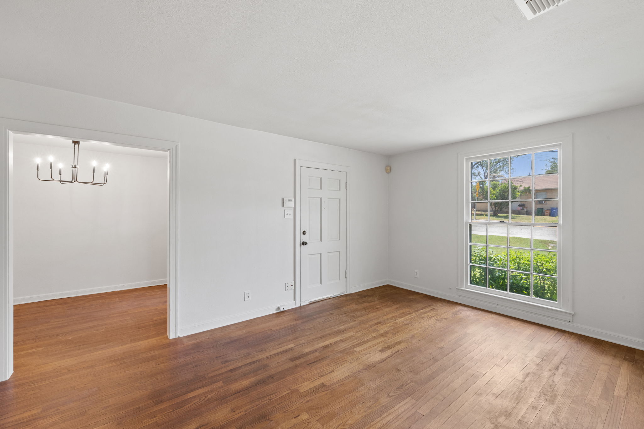 3704 Cherrywood Road Austin, TX 78722 - Photo 10 of 40 Living area opening to dining room with an abundance of light.