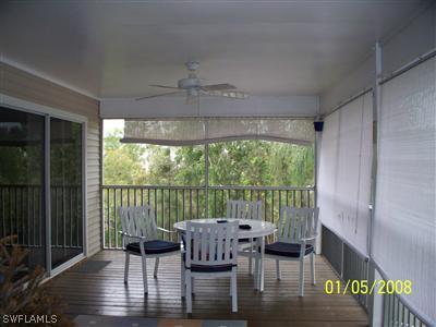 10684 Russell Road Bokeelia, FL 33922 - Photo 6 of 10 a view of a dining room with furniture window and outside view