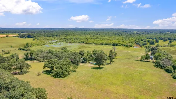 a view of a lake with a yard