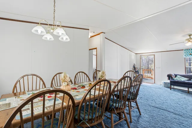 a kitchen with stainless steel appliances a refrigerator and a table