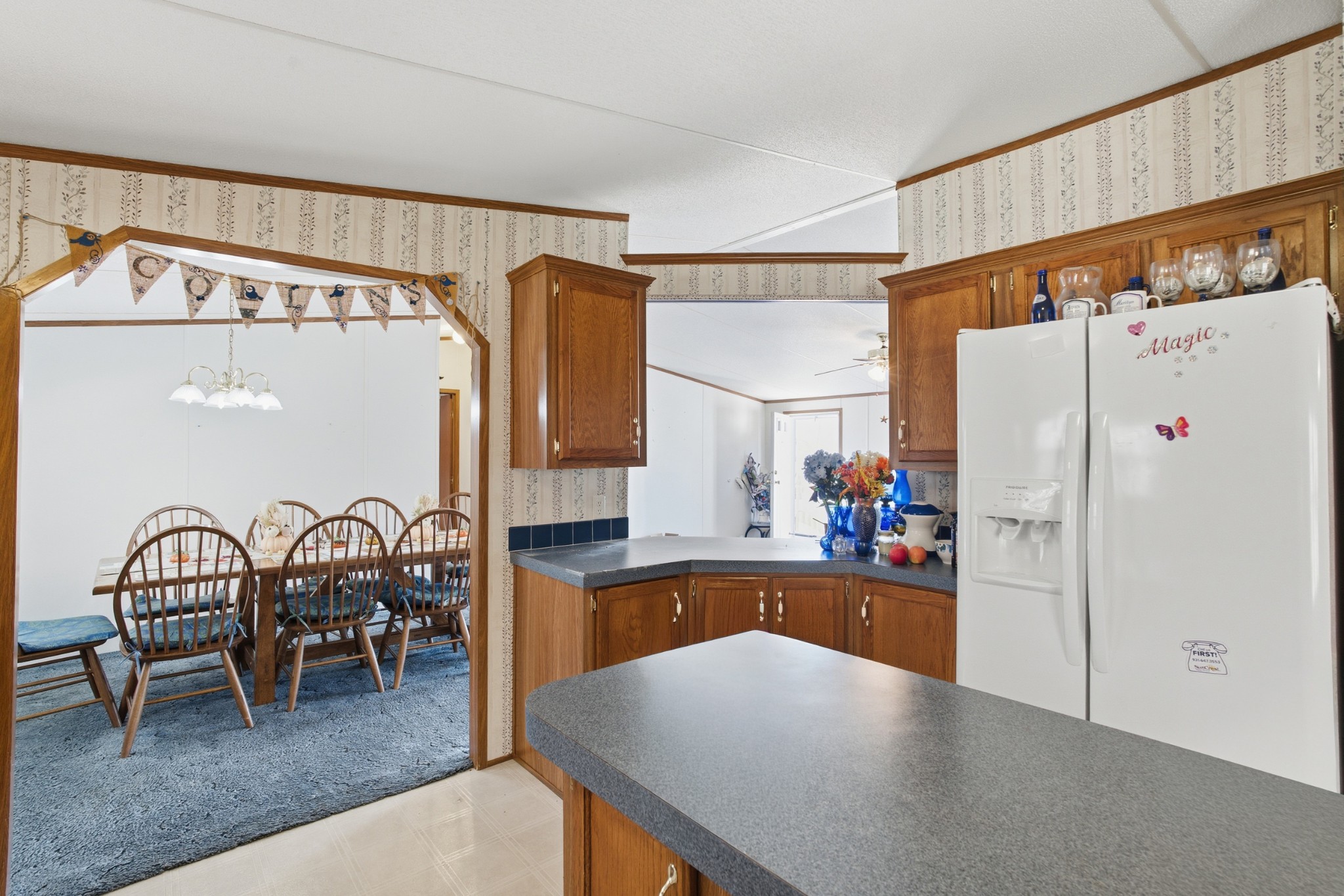 1700 Cumberland Valley Road Erin, TN 37061 - Photo 15 of 24 a kitchen with stainless steel appliances a refrigerator and a table