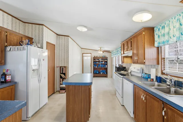a view of a kitchen with furniture and a window