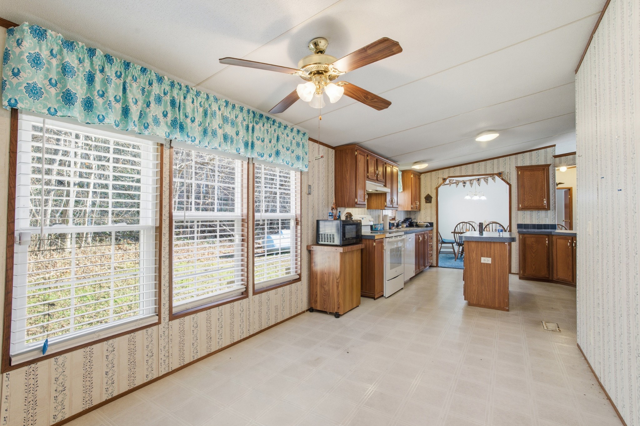 1700 Cumberland Valley Road Erin, TN 37061 - Photo 17 of 24 a view of a kitchen with furniture and a window