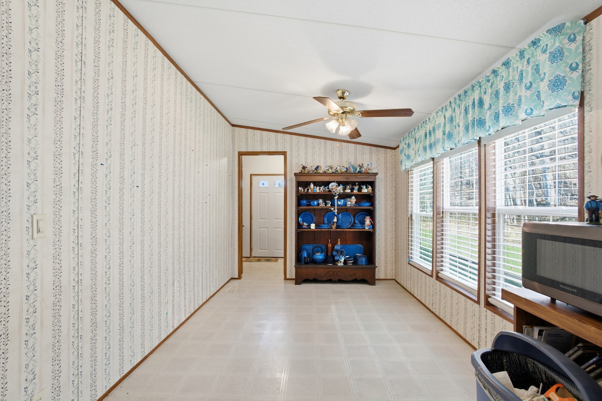 1700 Cumberland Valley Road Erin, TN 37061 - Photo 18 of 24 a view of an empty room with a window and cabinet