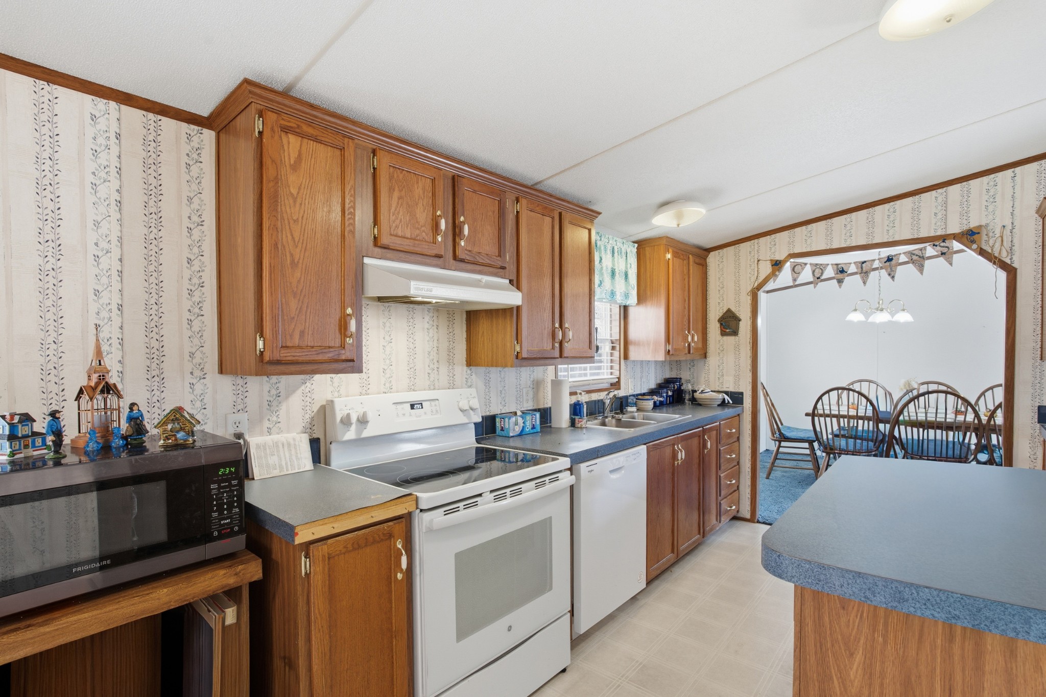 1700 Cumberland Valley Road Erin, TN 37061 - Photo 19 of 24 a kitchen that has a sink and a stove in it