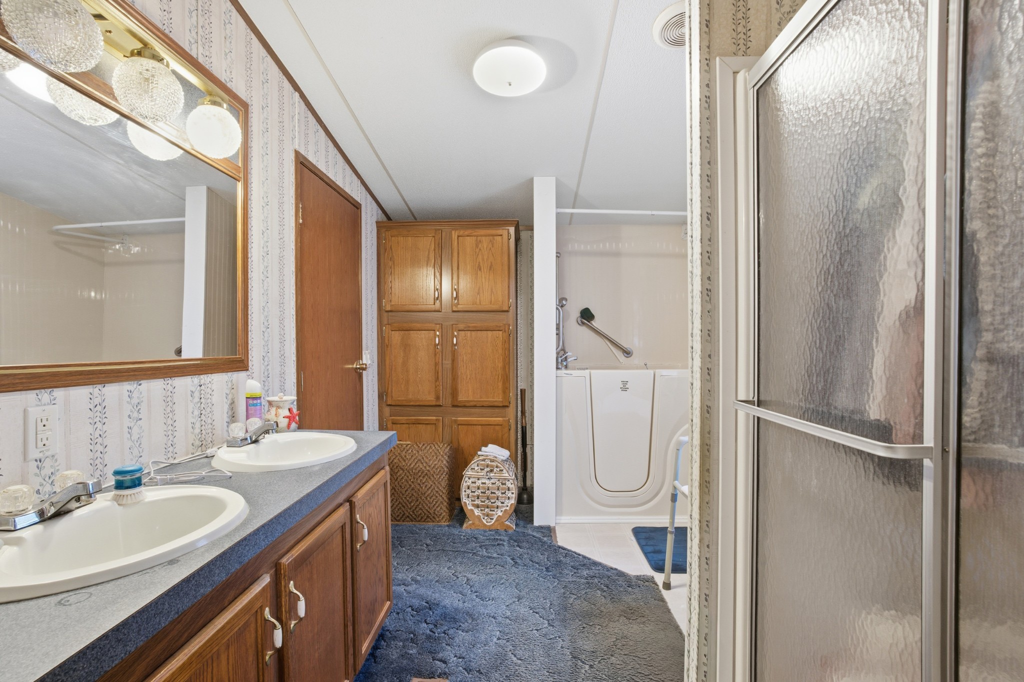 1700 Cumberland Valley Road Erin, TN 37061 - Photo 24 of 24 a spacious bathroom with a double vanity sink a mirror and a shower
