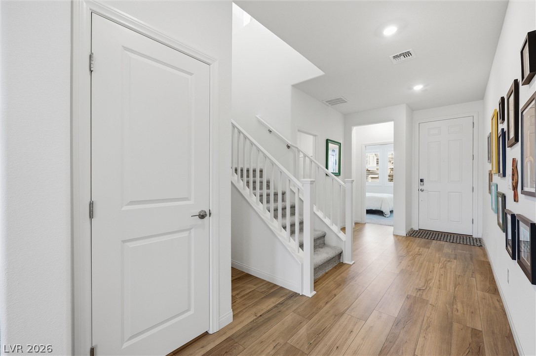 3705 Alla Rocca Avenue Henderson, NV 89044 - Photo 5 of 50 This welcoming entryway features warm flooring and a prominent staircase leading to upper levels.